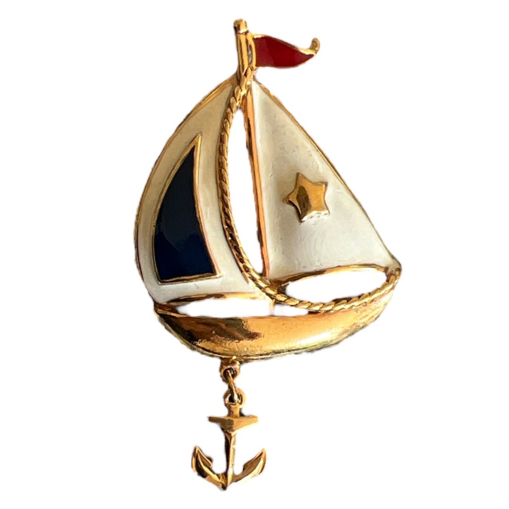 Metal sailboat brooch with swinging anchor